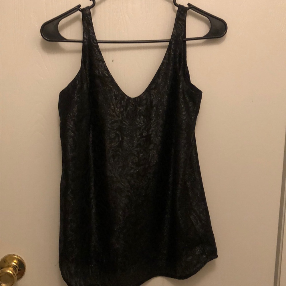 This is a black and glitter patterned top